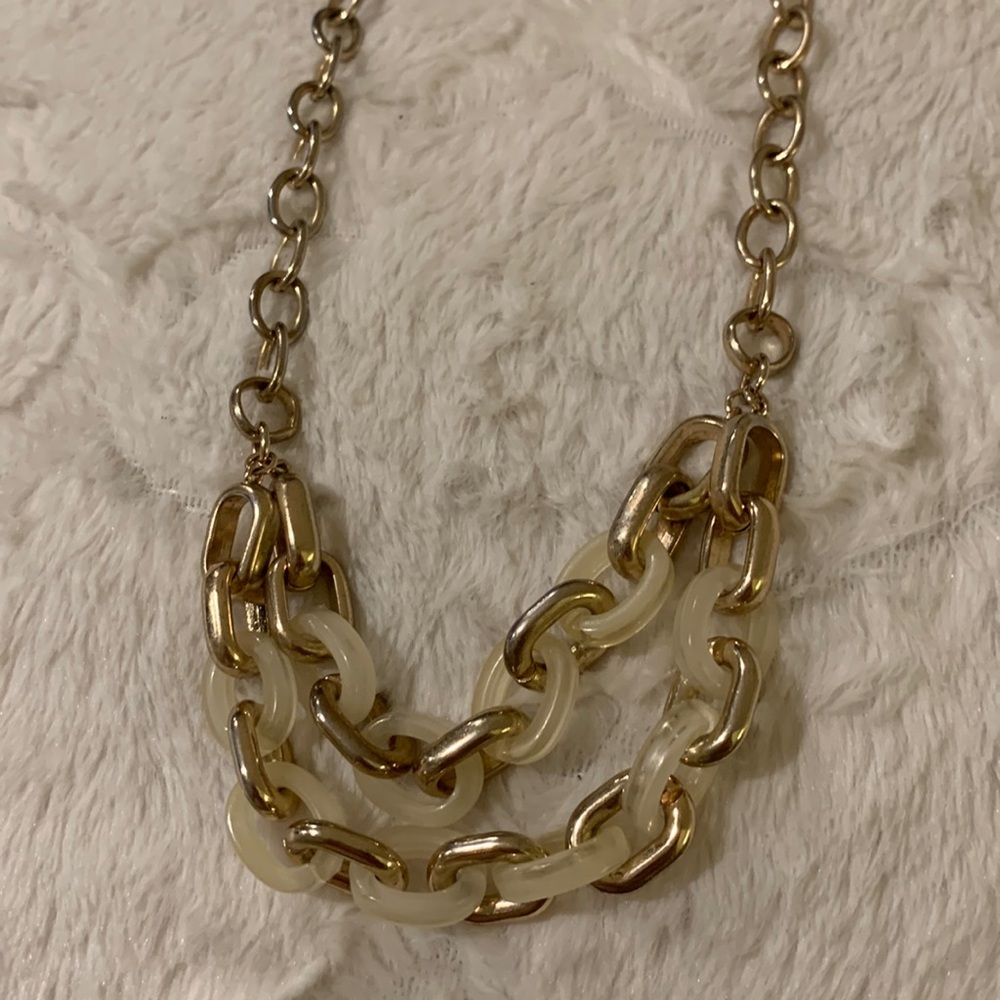 Banana Republic .Gold tone with cream plastic